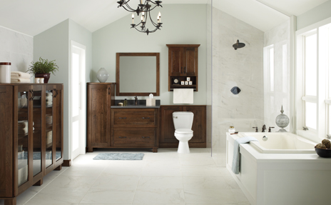 Bathroom with white tile flooring, wood cabinets, and white tub 